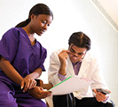 Nurse and doctor with patient chart.