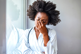 young female doctor with a headache