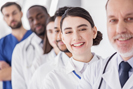 Diverse group of doctors in scrubs and lab coats, 