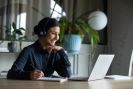 Female doctor with laptop, online learning