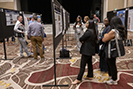 people at poster exhibit at meeting