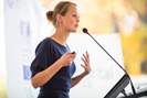 Female Speaker at Podium